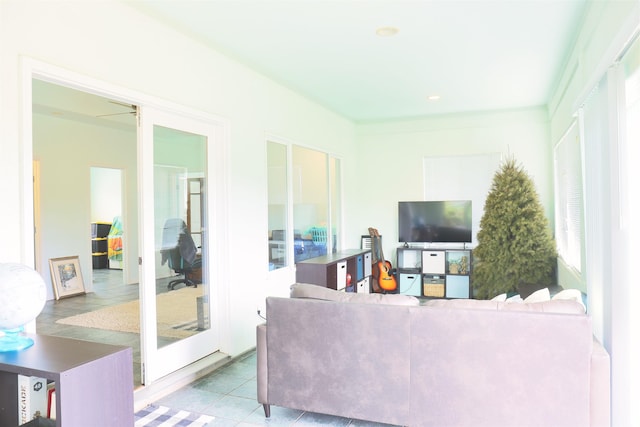 tiled living room featuring french doors