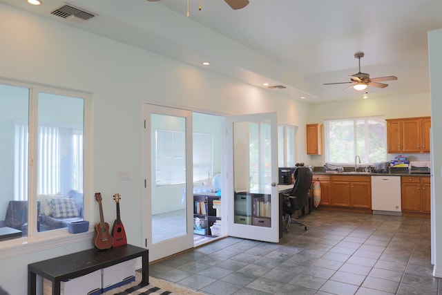 kitchen featuring ceiling fan, tile patterned floors, dishwasher, and sink