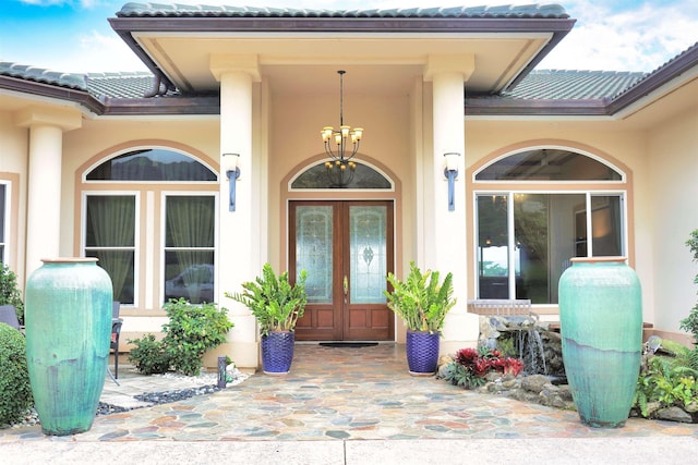 property entrance featuring french doors