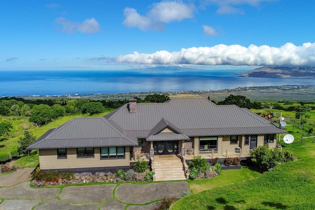 view of front of house with a porch, a water view, and a front yard