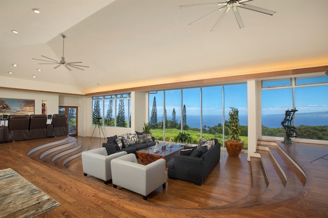 living room featuring ceiling fan, lofted ceiling, and wood-type flooring