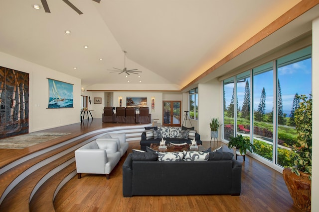 living room with lofted ceiling, ceiling fan, a healthy amount of sunlight, and hardwood / wood-style flooring