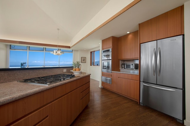 kitchen featuring stainless steel appliances, dark hardwood / wood-style floors, backsplash, decorative light fixtures, and a chandelier