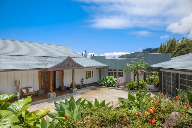 rear view of property with a patio