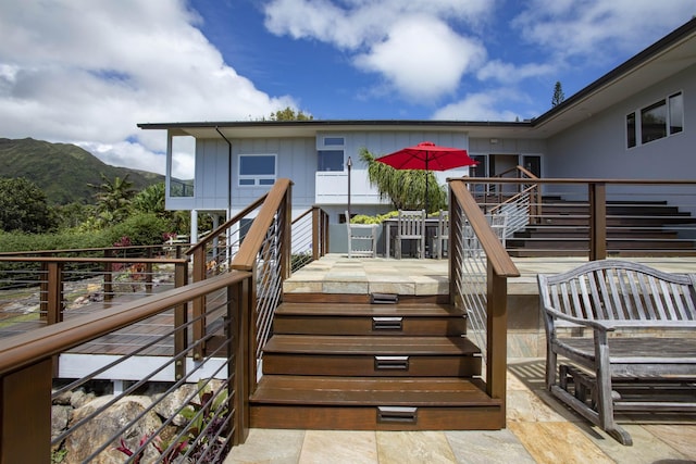 wooden deck featuring a mountain view