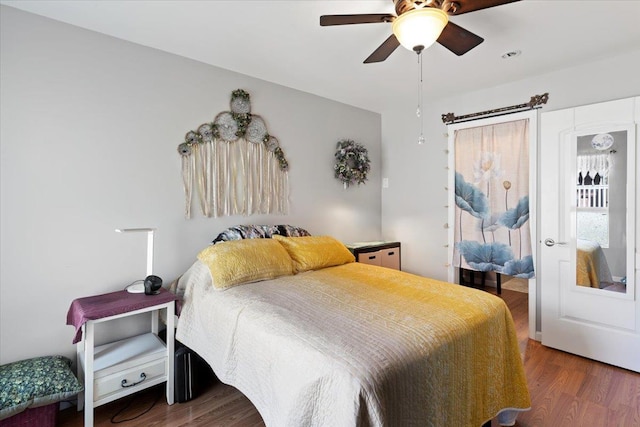 bedroom with dark wood-type flooring and ceiling fan