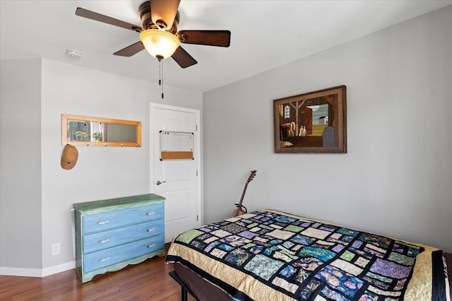 bedroom featuring dark hardwood / wood-style floors and ceiling fan