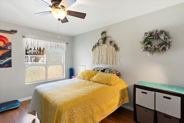 bedroom with dark wood-type flooring and ceiling fan