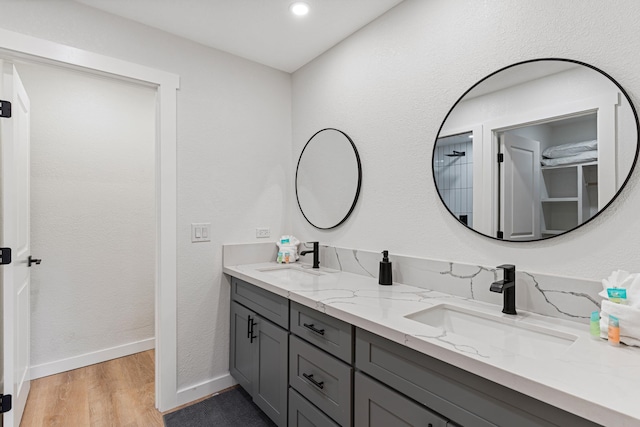 bathroom with vanity and hardwood / wood-style floors