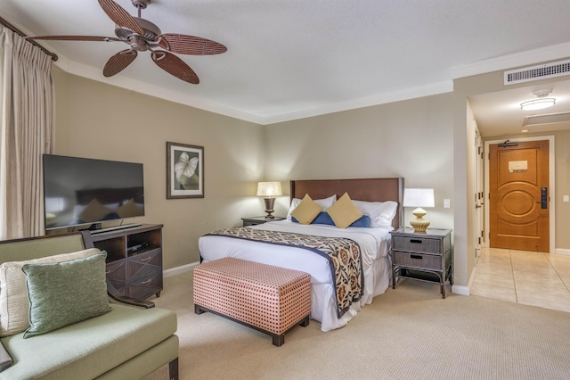 bedroom with ornamental molding, visible vents, carpet floors, and baseboards