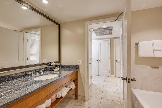 full bath with recessed lighting, tile patterned floors, a bath, vanity, and visible vents