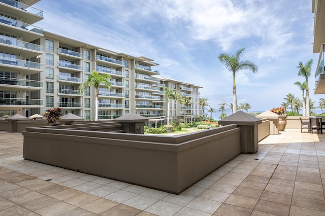 view of patio featuring a balcony