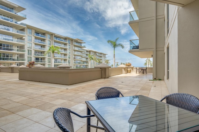view of patio / terrace with outdoor dining space and a balcony