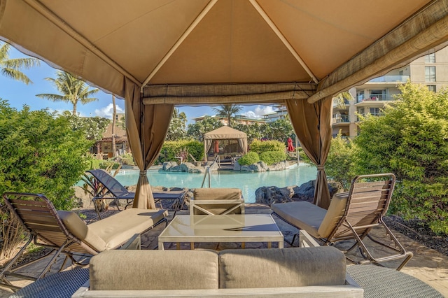 view of patio with a gazebo and an outdoor pool
