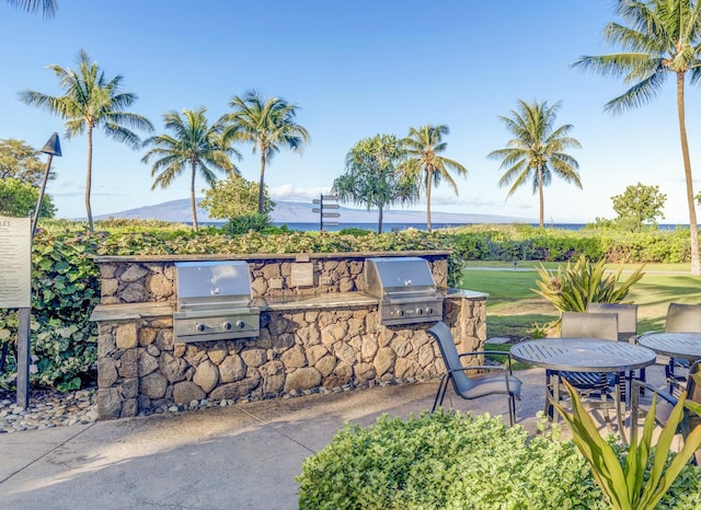 view of patio featuring exterior kitchen and area for grilling