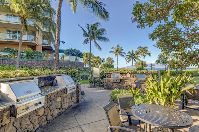 view of patio with exterior kitchen and grilling area