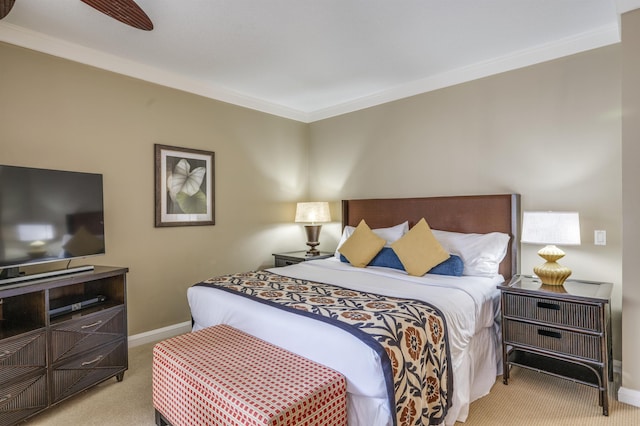 bedroom featuring ornamental molding, light carpet, and baseboards