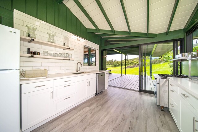 40723 Hana Hwy, Hana, HI 96713 - kitchen with light hardwood / wood-style floors, sink, white cabinetry, and appliances with stainless steel finishes