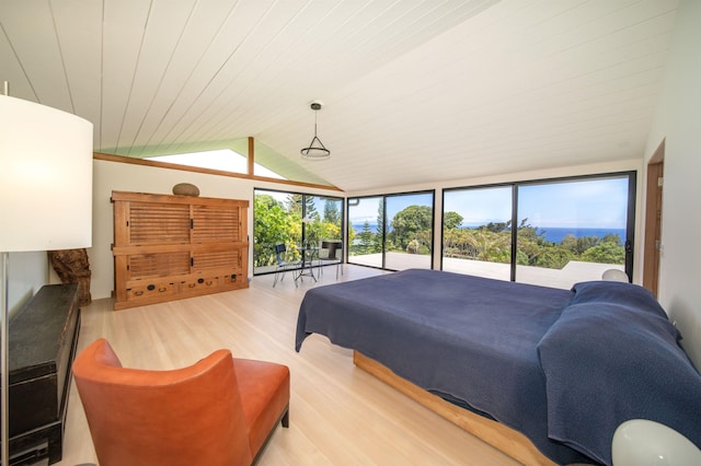 bedroom with a wall of windows, access to outside, vaulted ceiling, wooden ceiling, and light hardwood / wood-style flooring