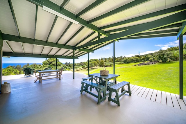 surrounding community featuring a patio area and a lawn