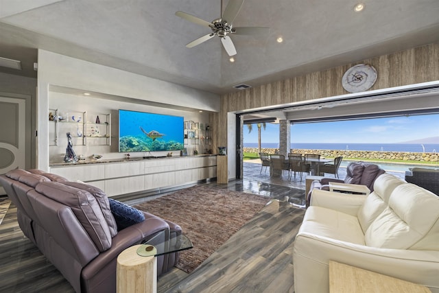 living room featuring ceiling fan and dark wood-type flooring