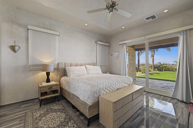 bedroom with ceiling fan, dark hardwood / wood-style floors, and access to outside