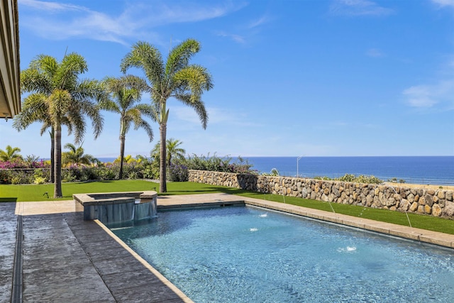 view of pool with pool water feature, a water view, an in ground hot tub, and a lawn