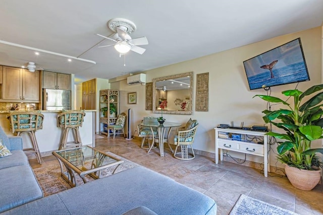 tiled living room featuring a wall unit AC and ceiling fan