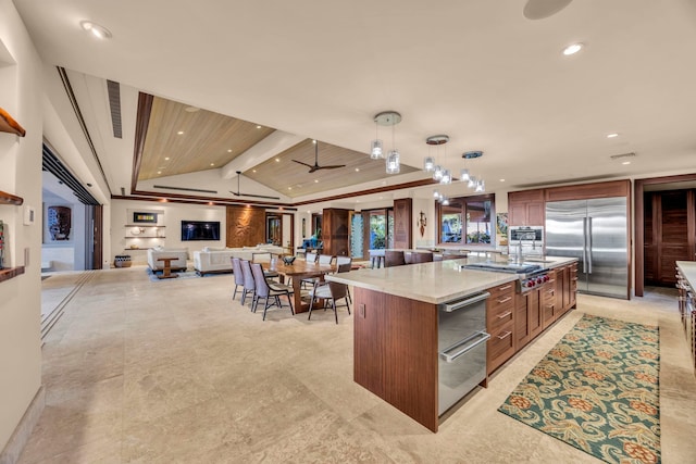 34 Ualei Pl, Kihei, HI 96753 - kitchen with recessed lighting, decorative light fixtures, a large island with sink, appliances with stainless steel finishes, and open floor plan