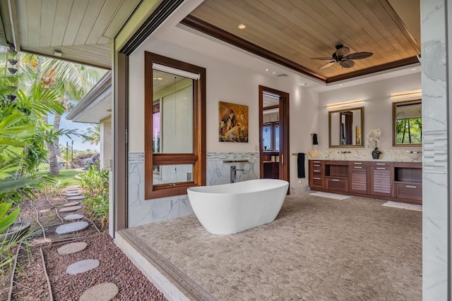 34 Ualei Pl, Kihei, HI 96753 - bathroom with ceiling fan, a tray ceiling, wooden ceiling, a freestanding tub, and vanity