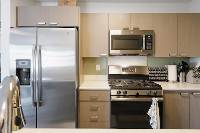 kitchen with stainless steel appliances and light countertops