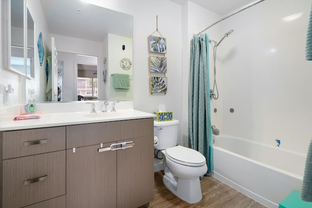 full bathroom with toilet, vanity, shower / bath combo, and wood finished floors