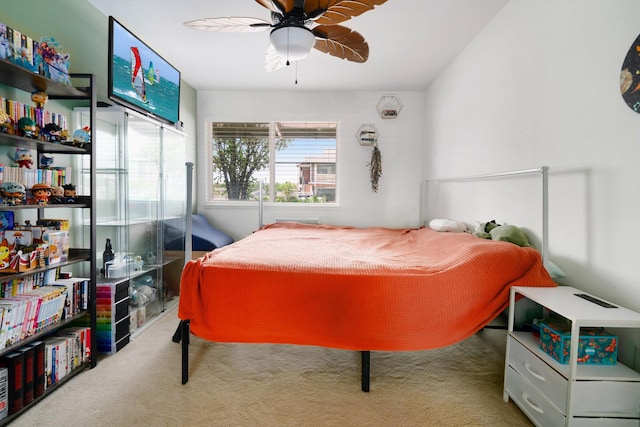 bedroom featuring a ceiling fan and carpet