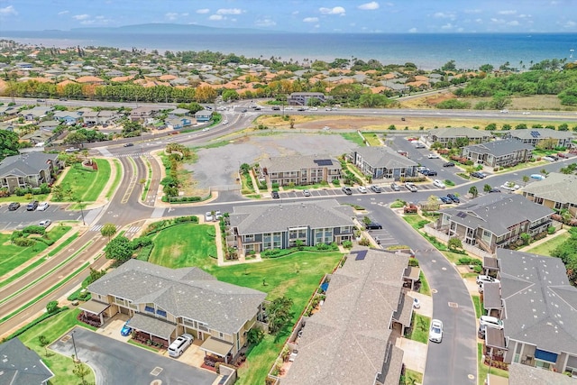 drone / aerial view with a residential view and a water view
