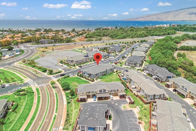 bird's eye view featuring a water view and a residential view