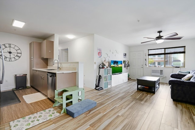 living area featuring a ceiling fan and light wood-style flooring