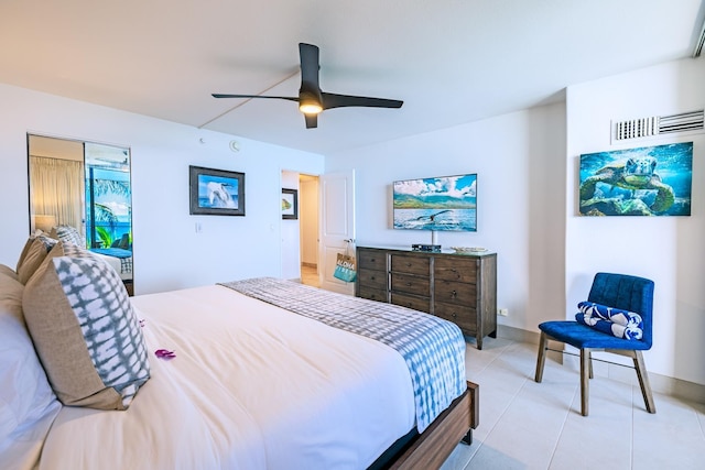 bedroom featuring ceiling fan, visible vents, and light tile patterned flooring