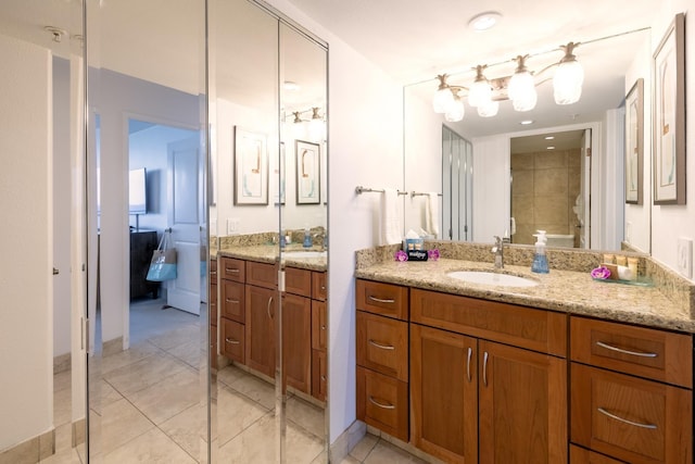 bathroom with tile patterned flooring and vanity