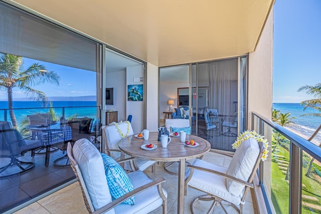 balcony featuring a water view and a sunroom