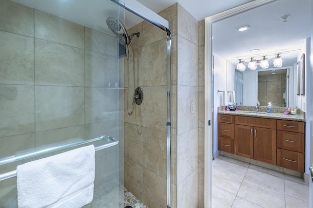 full bath featuring tile patterned floors, a shower stall, and vanity