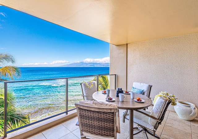 balcony featuring a water view