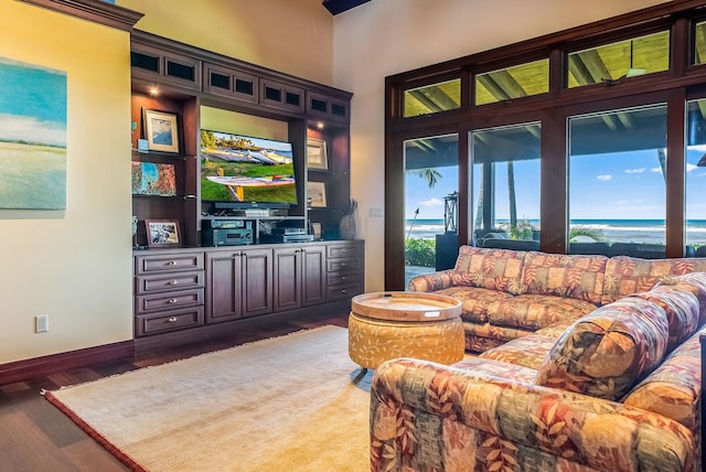 living room featuring wood finished floors and baseboards