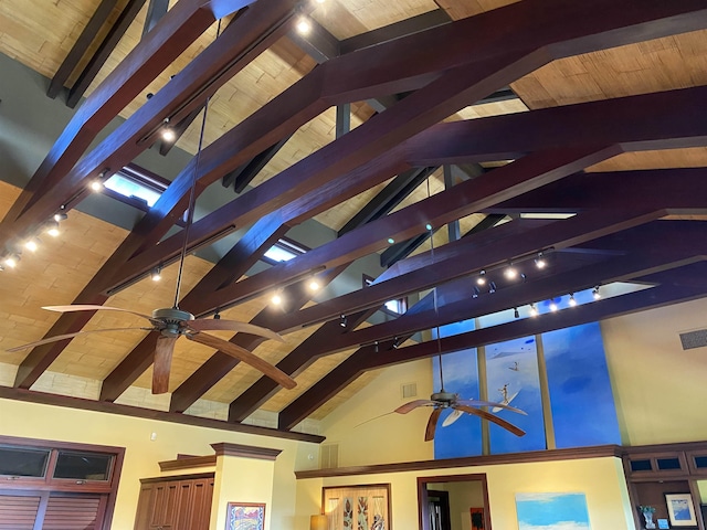 room details with beam ceiling and a ceiling fan