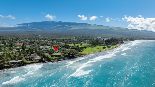 birds eye view of property with a water and mountain view