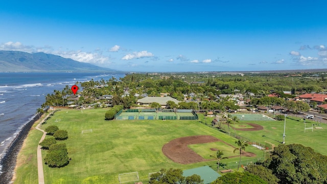 drone / aerial view featuring a water and mountain view