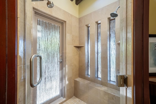 full bathroom with a tile shower