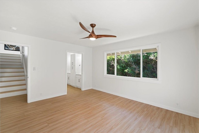 2825 Kauhale St, Kihei, HI 96753 - unfurnished room featuring stairs, light wood-style flooring, and a ceiling fan