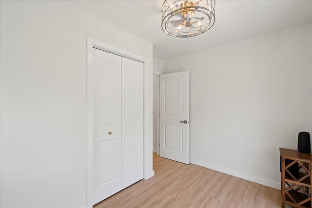 2825 Kauhale St, Kihei, HI 96753 - unfurnished office featuring light wood-style floors and a chandelier