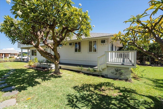 2825 Kauhale St, Kihei, HI 96753 - back of property with a lawn, a wall unit AC, and a deck