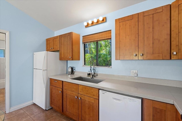 2825 Kauhale St, Kihei, HI 96753 - kitchen with white appliances, brown cabinets, light tile patterned floors, and light countertops